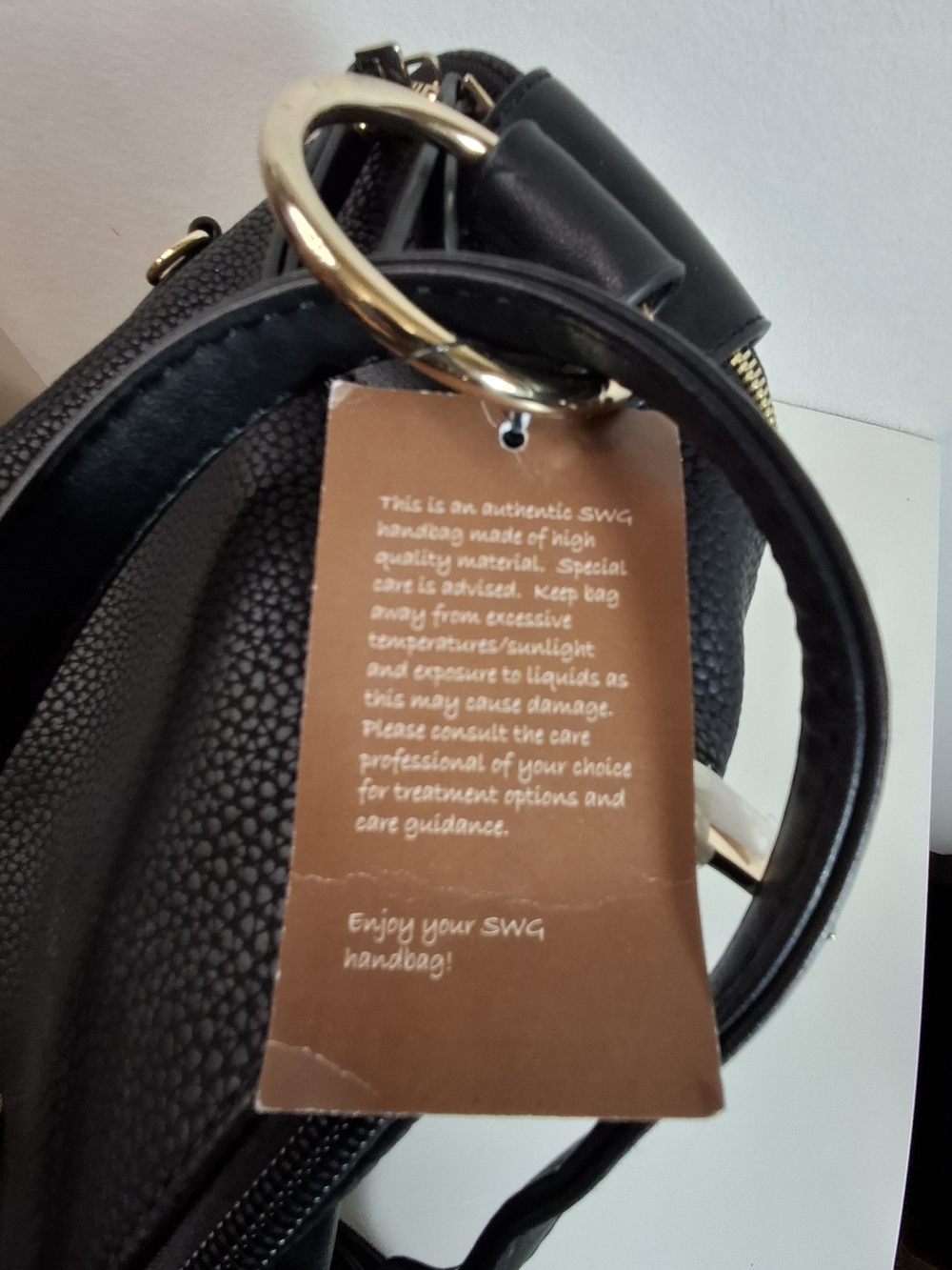 SWG Black Pebbled Sling Barrel Backpack with Gold Accents - Picture 10 of 11
